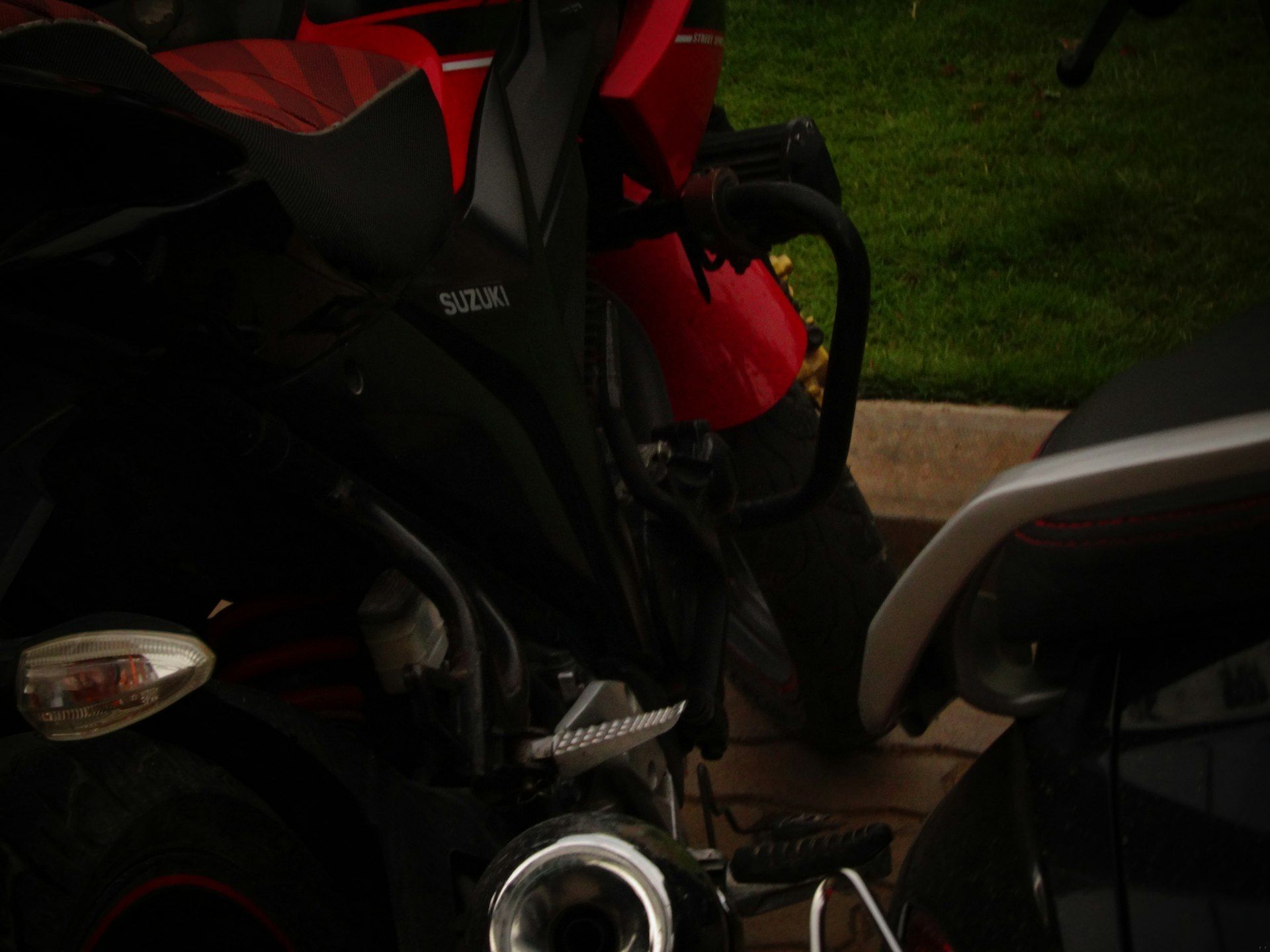 Two motorcycles parked side by side